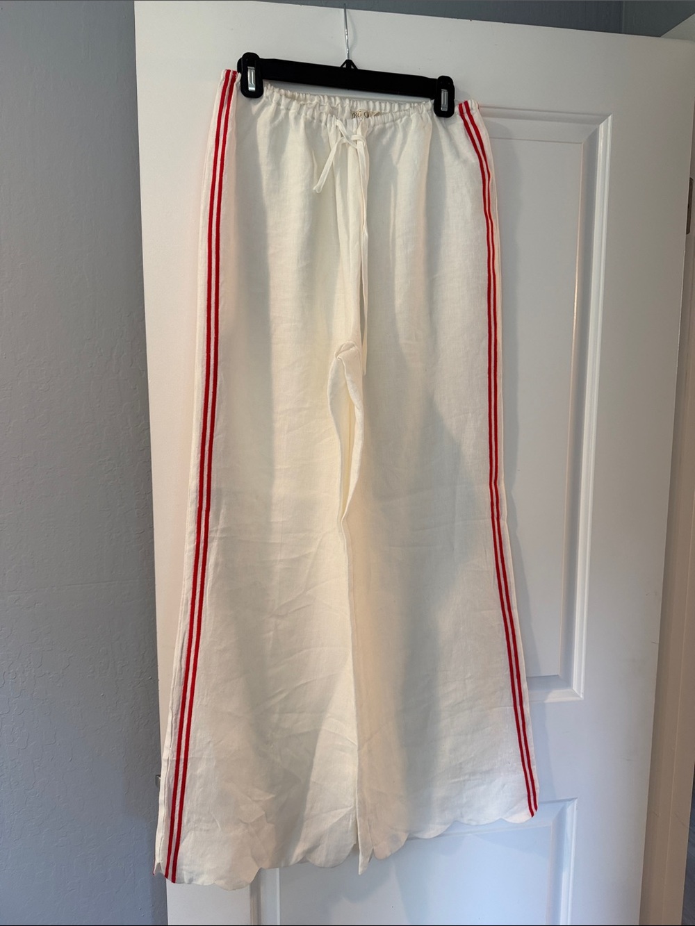 Woman Cream Wide-Leg Pants with Red Side Stripes scalloped hem